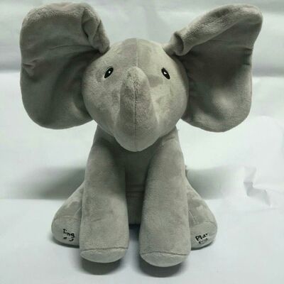 Серый взгляд украдкой игрушки плюша музыки шиканья, электронная заполненная игрушка слона